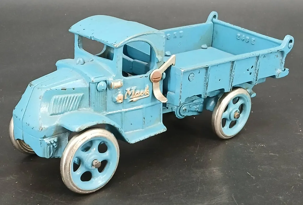Antique Mack toy truck with silver wheels