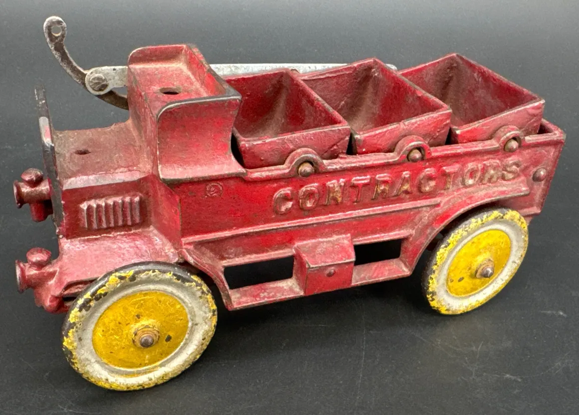 Old red contractor toy vehicle, rustic design